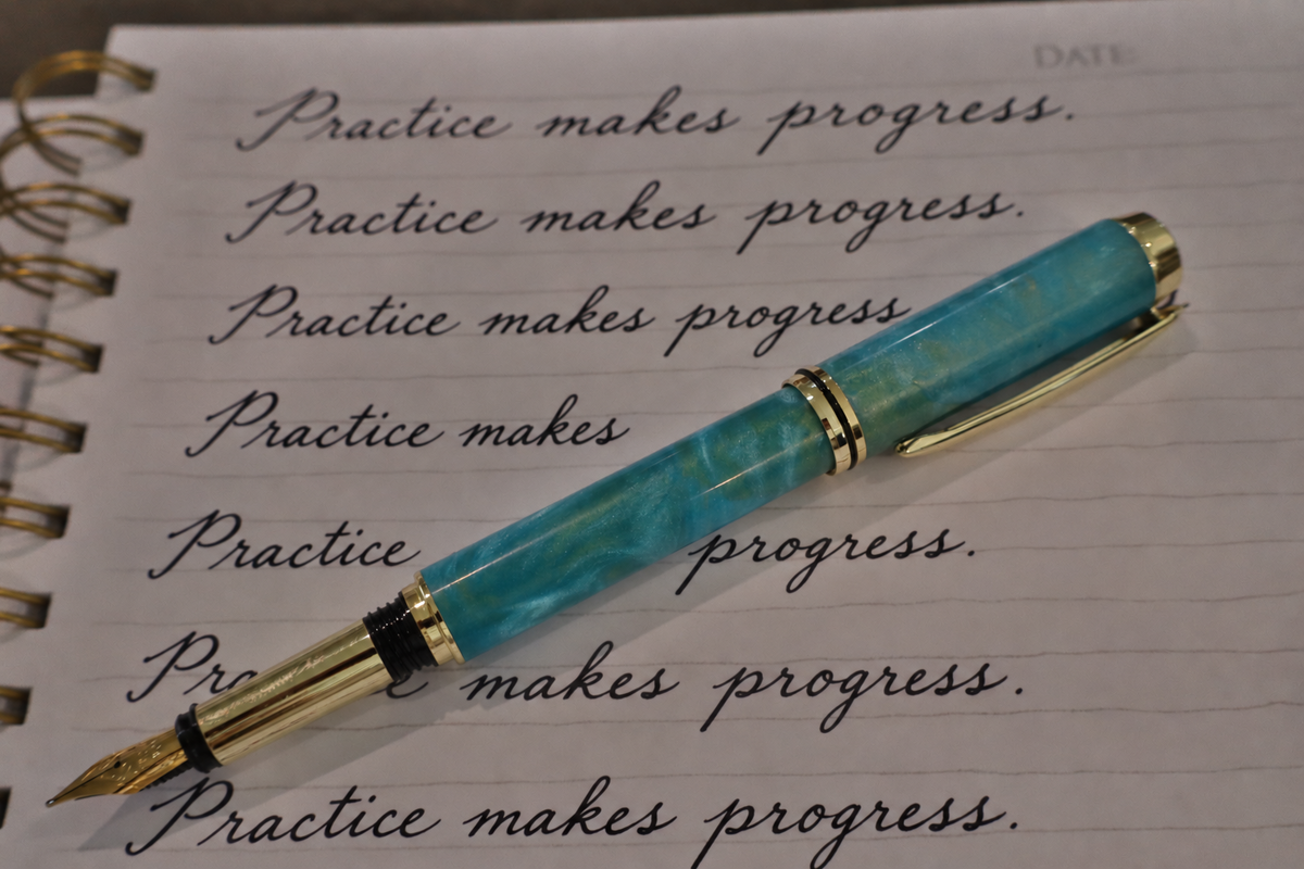 Handmade blue resin inlay fountain pen with gold-tone fittings