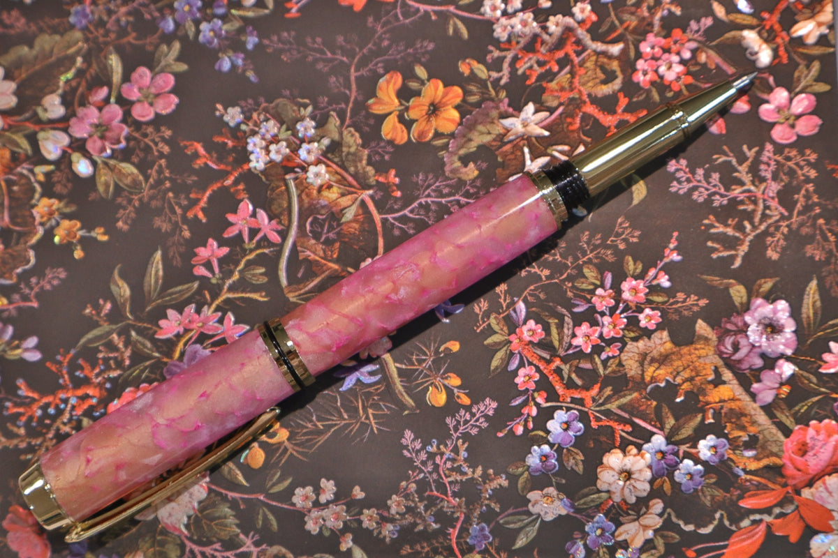 Handmade pink twist ballpoint pen with gold-tone fittings