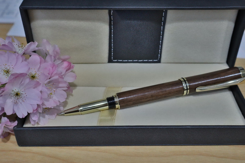 Handmade walnut JR Gents style rollerball pen uncapped showing the rollerball tip