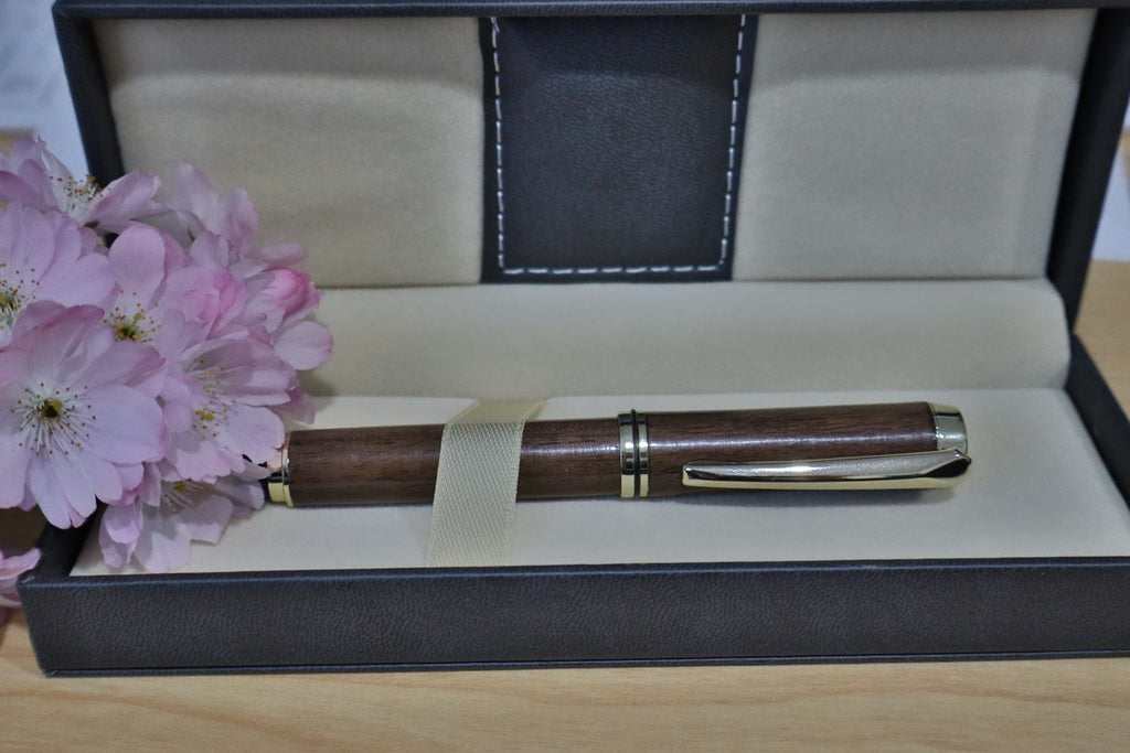 Handmade walnut JR Gents style rollerball pen shown from the side